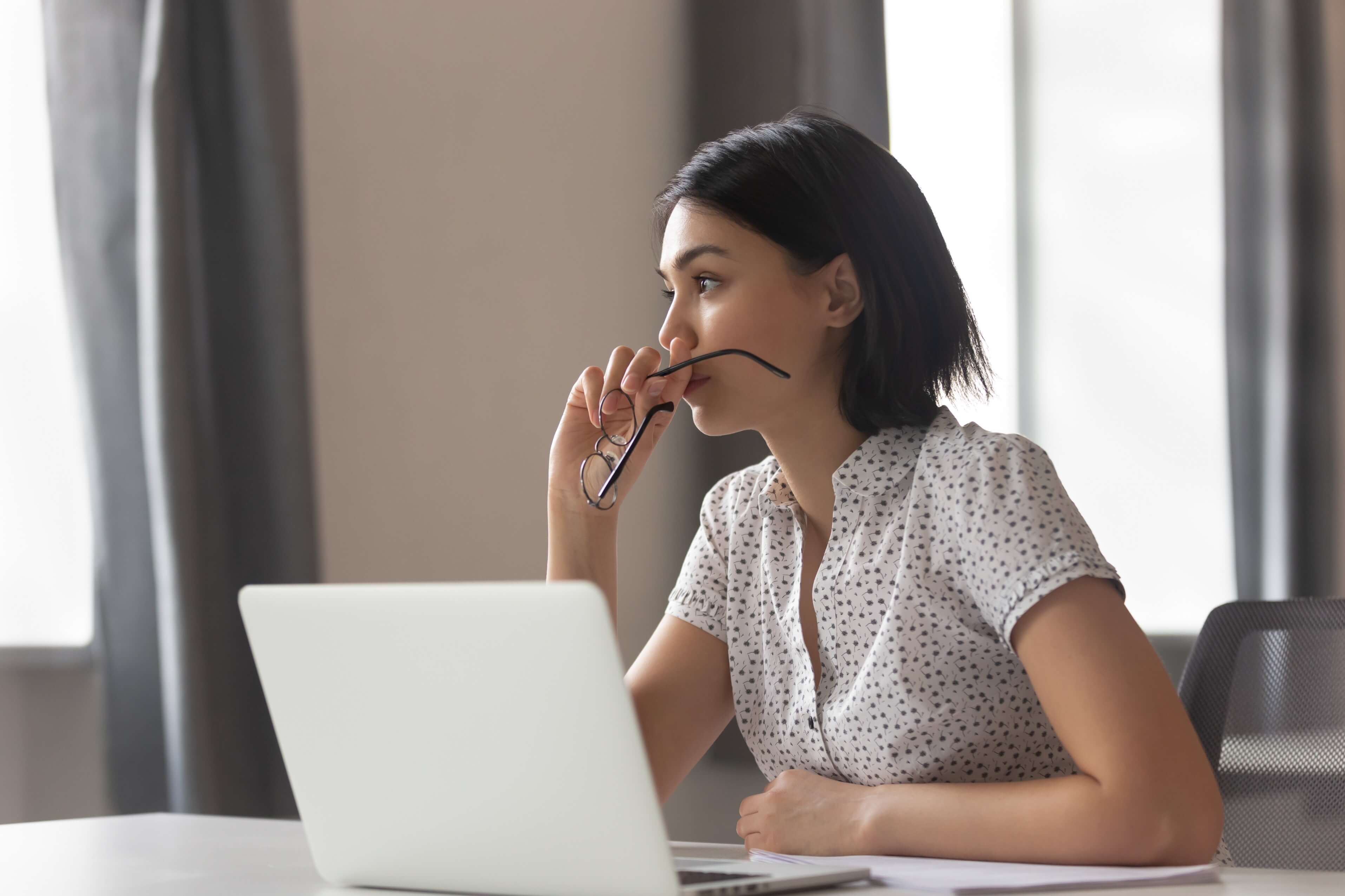 Woman sat working on a laptop