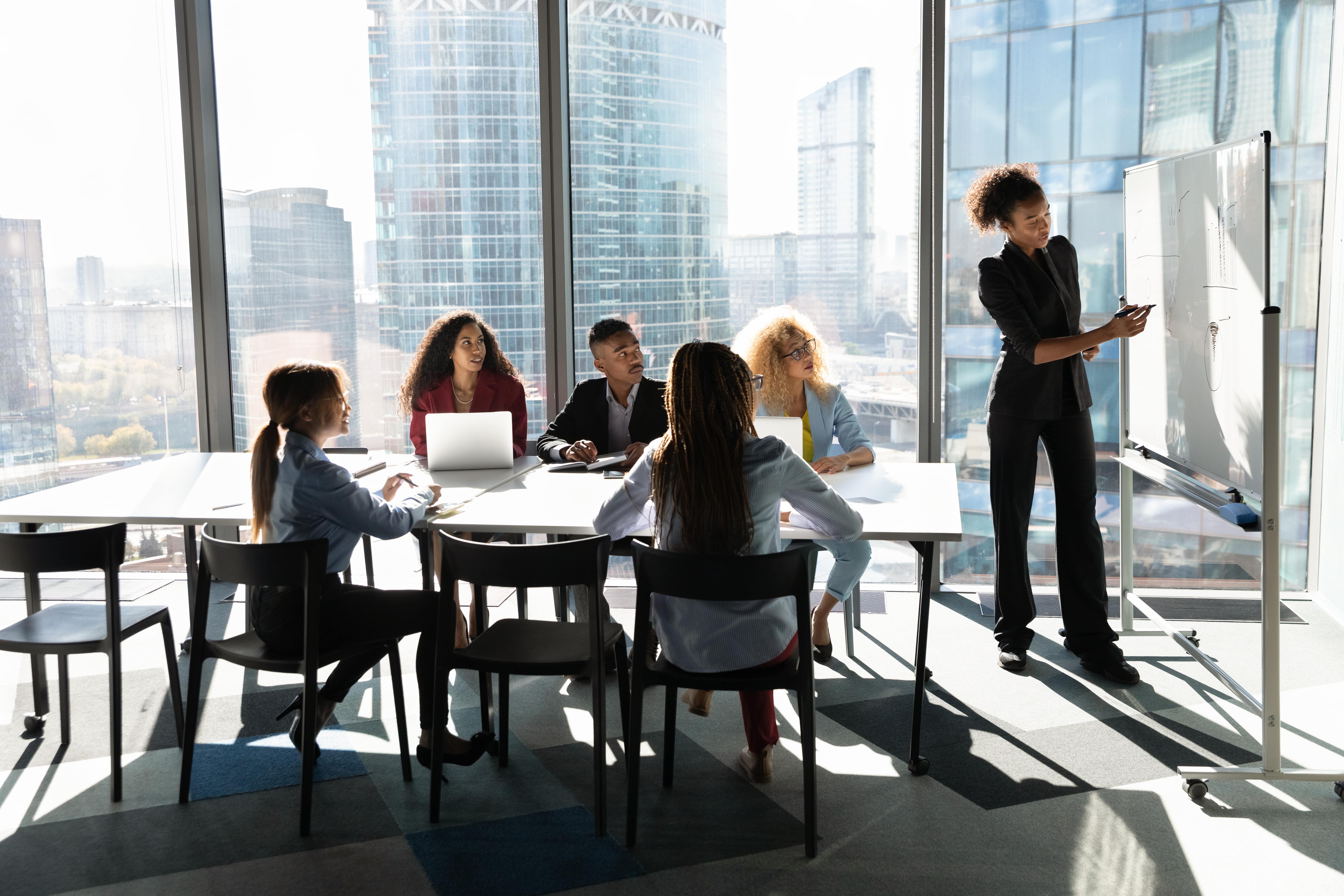 A group of diverse employees conducting training 